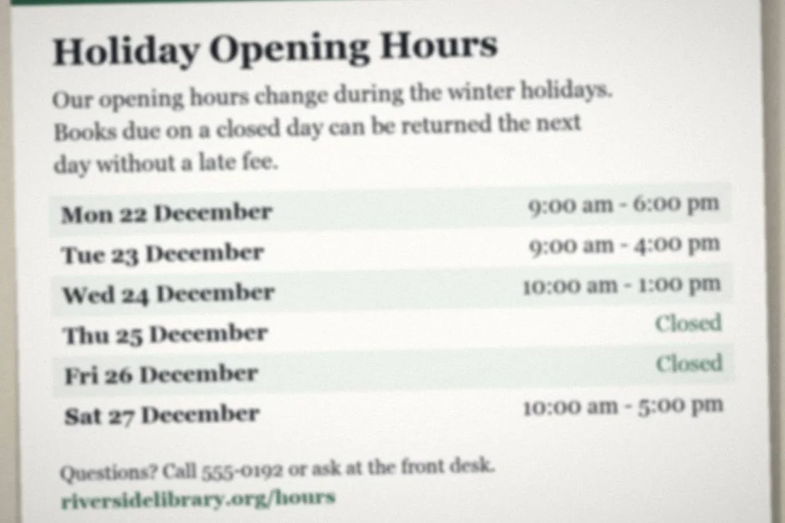 Out-of-focus library notice with blurry holiday opening hours